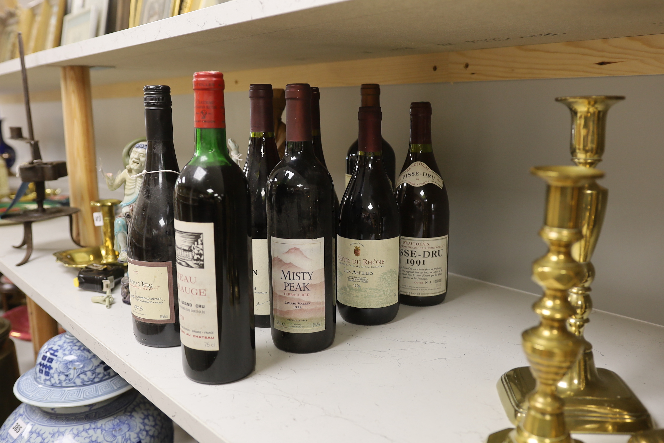 Eight various bottles of wine - Chateau Fombrauge Saint Emilion 1979, Cotes Du Rhone Les Alpilles 1999, Chateau Beaumont 2010, Ata Rangi Pinot Noir 1993, Corton Grand Cru 1993, Pisse Dru 1991, Concha Y Toro Pino Noir 200